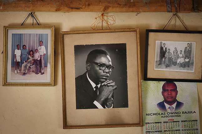 The president scarcely knew his Kenyan father, Barack Obama, Sr., whose portrait hangs (center) in the family house in Kogelo, western Kenya. (PETER MACDIARMID/GETTY IMAGES)