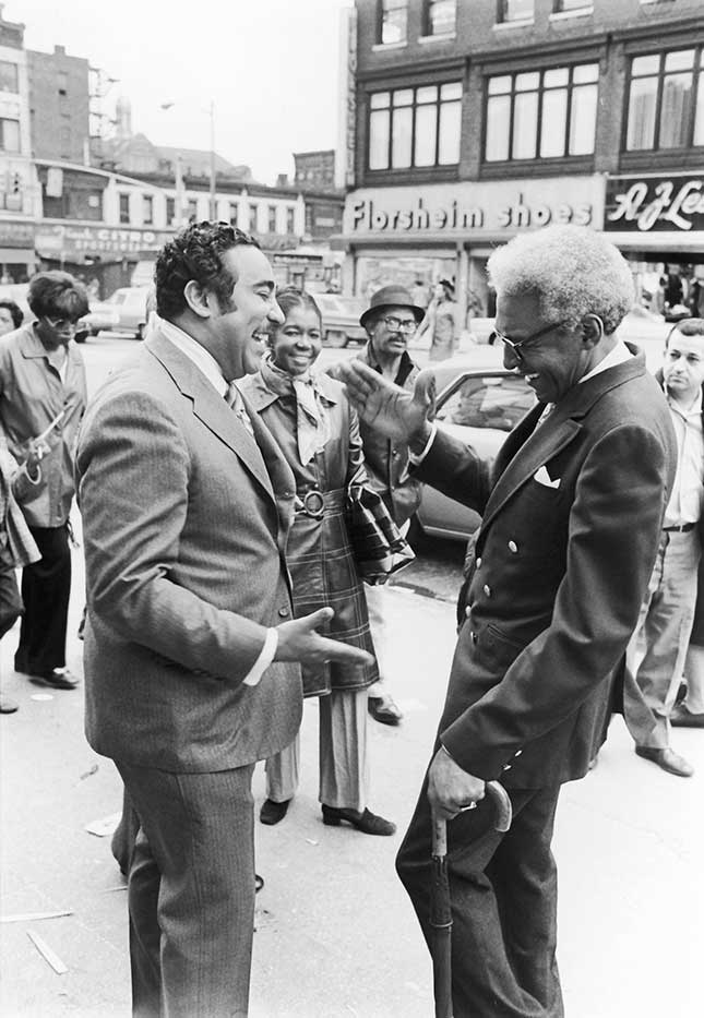 Seen here with civil rights leader Bayard Rustin in 1970, Rangel established a political fiefdom in Harlem based on dispensing government money to favored interests. (MONETA SLEET, JR./EBONY COLLECTION/AP IMAGES)