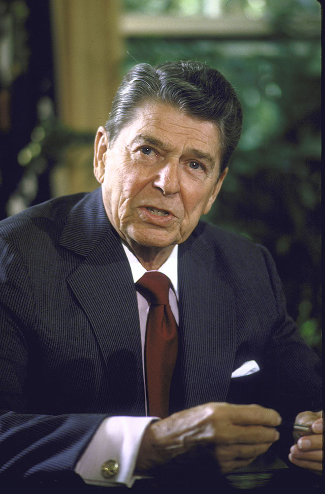 Coming to the Oval Office after a long period of high unemployment and crippling inflation, Ronald Reagan launched a tax campaign that took rates to a Coolidge-esque 28 percent—fueling a new expansion. (DIANA WALKER/TIME LIFE PICTURES/GETTY IMAGES)