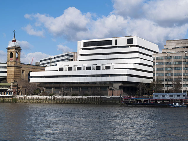 Like many Brutalist projects, Mondial House—a mutant eight-story ziggurat clad in bright white plastic on the Thames’s north bank—had a short shelf life. It was demolished in 2006. (ARCHAEO IMAGES/ALAMY STOCK PHOTO)