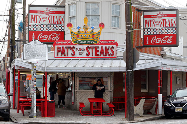 East Passyunk’s Pat’s King of Steaks, credited with creating the cheesesteak in 1933, is a Philadelphia culinary landmark. (ROBERT K. CHIN - STOREFRONTS/ALAMY STOCK PHOTO)