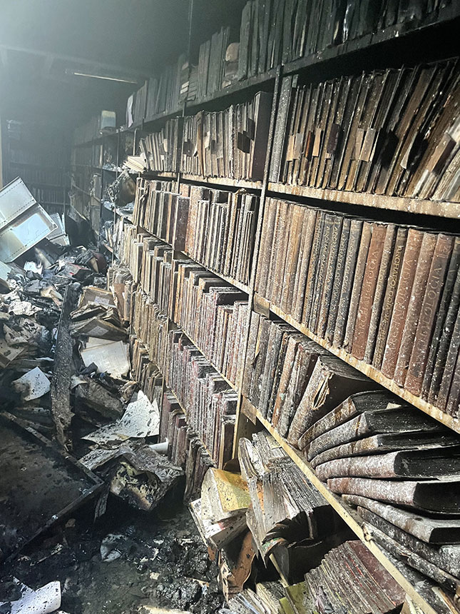 A portion of Downie’s ruined shelves after the arson