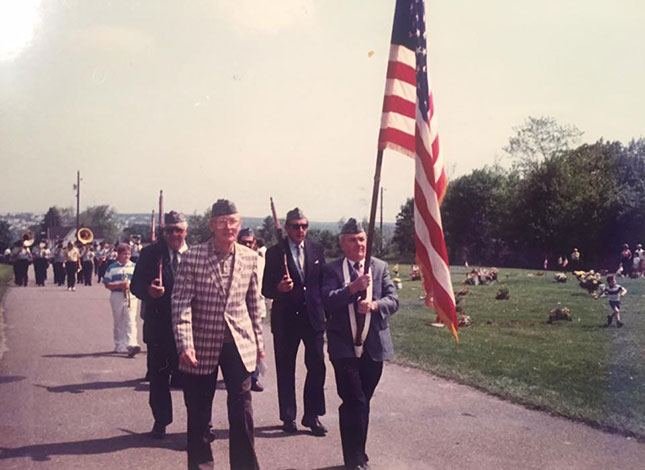 The author's grandfather, Charles "Tess" McElwee (front left), marching at St. Gabriel's Cemetery on Memorial Day, 1988.