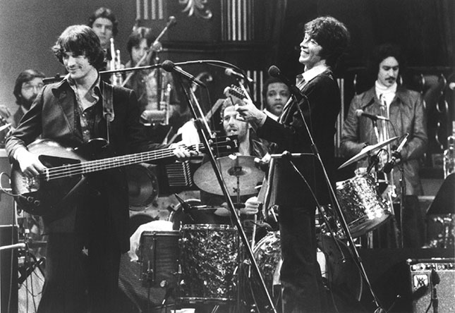 From left to right: Rick Danko, Levon Helm (behind drums), and Robbie Robertson, performing in their final concert, filmed by Martin Scorsese and released as The Last Waltz (MICHAEL OCHS ARCHIVES/GETTY IMAGES)