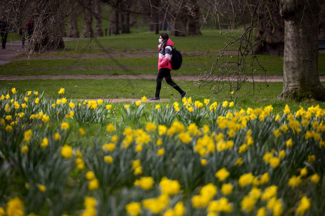 According to one survey, more than half of British citizens want to remain masked forever. (TOLGA AKMEN/AFP/GETTY IMAGES)