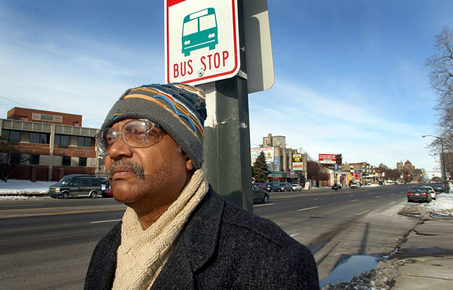 Trying to take a bus from downtown Detroit to the outskirts or suburbs involves long waits, often in isolated areas. (CARLOS OSORIO/AP PHOTO)