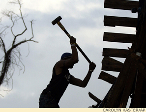 A resilient society depends on engaged citizens, like this New York volunteer helping to rebuild New Orleans after Katrina.